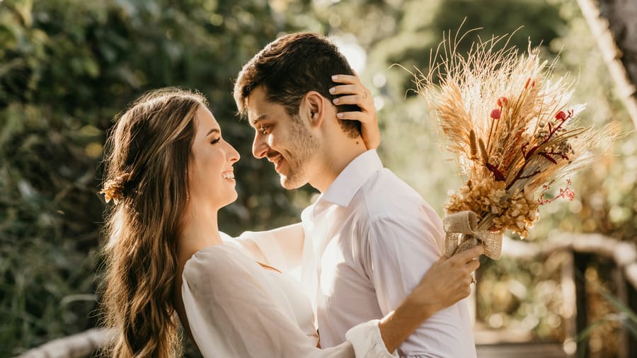 A woman with a polished companion in a formal occasion setting.