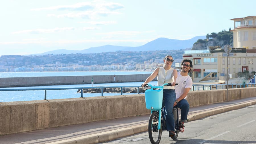 A woman and her companion sharing an outdoor travel moment.