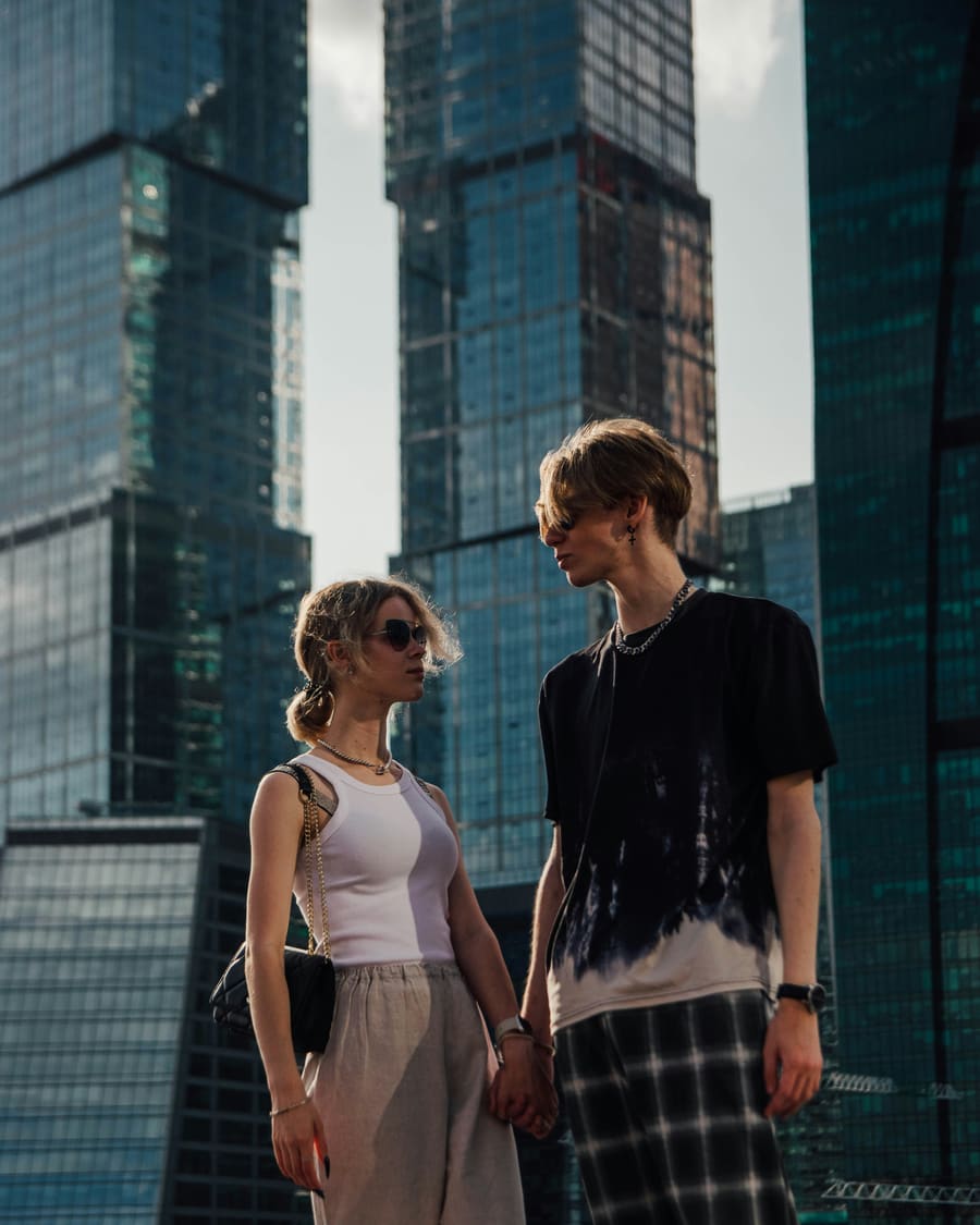 A woman and her companion enjoying time together in a city setting.